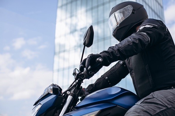 Motorcyclist on his bike riding in the city