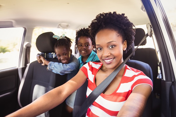 Family posing together in the car