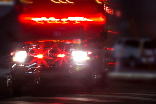 An ambulance rushes to the scene of an accident.