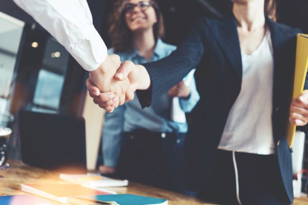 Attorney and client shake hands