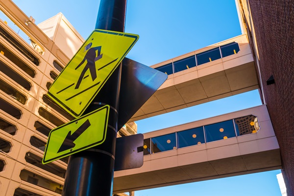 Pedestrian crossing sign in Atlanta with skywalks and buildings in the background. (162901141)