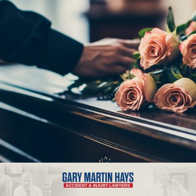 Flowers on the casket of an Atlanta wrongful death victim