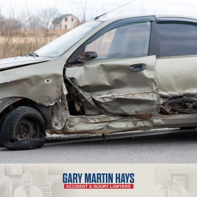 A broadsided car sits in the road in Atlanta after a T-bone accident